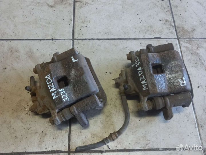 Передние суппорта Mazda 323F