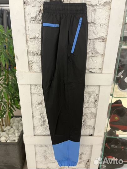 Брюки Nike Windrunner Woven Lined Pants DX0653 010