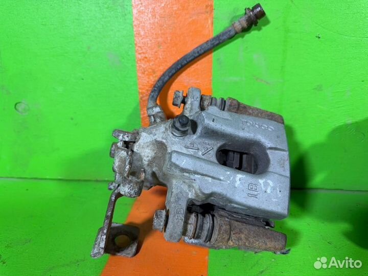 Суппорт задний Toyota Corolla E150 1ZR 2012