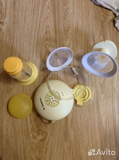 Молокоотсос medela электрический