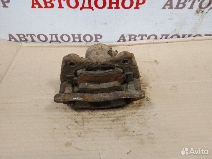 Суппорт тормозной передний правый Nissan Micra K12