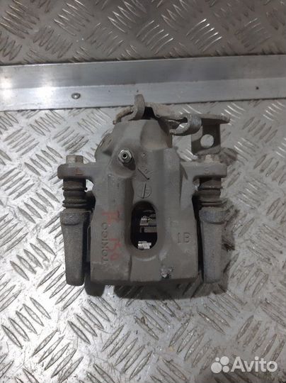 Суппорт задний левый Toyota Corolla E150 1ZR-FE