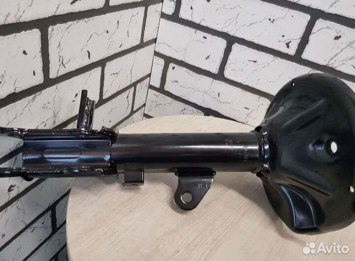 Амортизатор шевроле перед. лев. оригинал