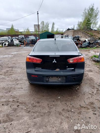 Трос лючка топливного бака Mitsubishi Lancer CY