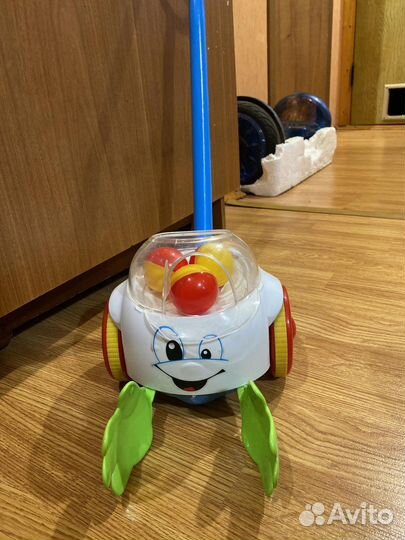 Игрушка каталка с ручкой