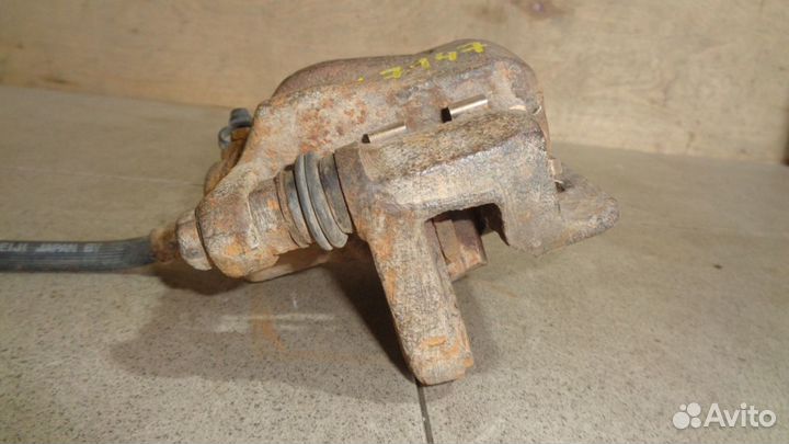 Суппорт задний левый Hyundai Sonata 4 (EF)