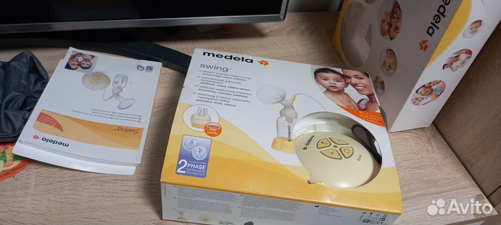 Эл. молокоотсос Medela swing с бутылками, сосками