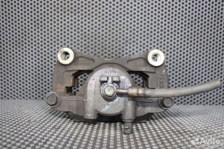 Суппорт тормозной передний левый Nissan Teana J31