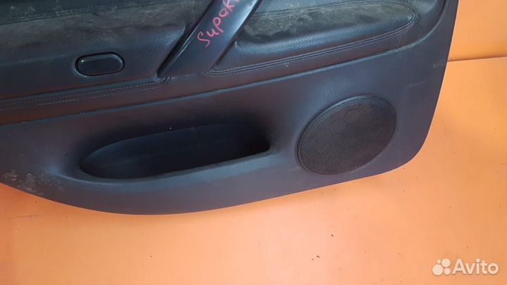 Обшивка задней левой двери на Skoda Superb