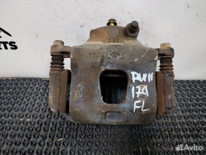 Суппорт тормозной передний левый Nissan Avenir