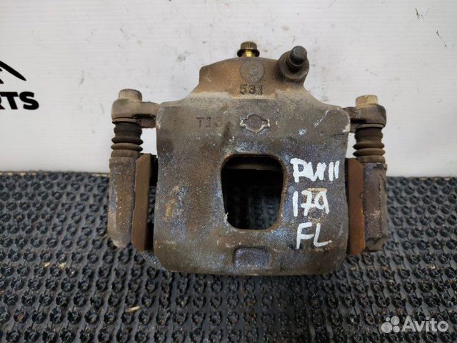 Суппорт тормозной передний левый Nissan Avenir