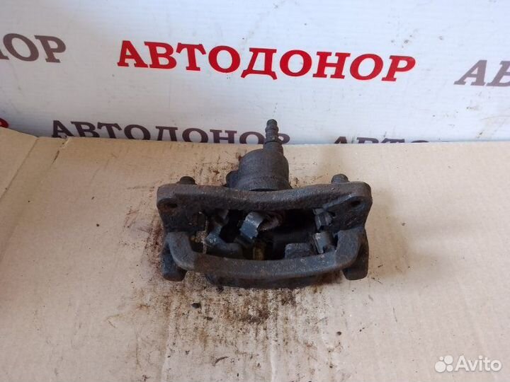 Суппорт тормозной задний левый Mitsubishi Galant