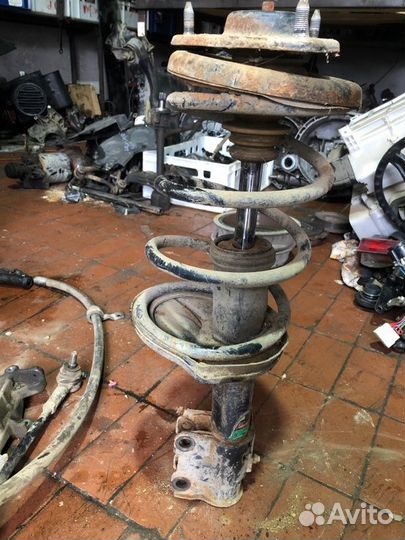 Стойка в сборе передняя Mitsubishi Lancer седан