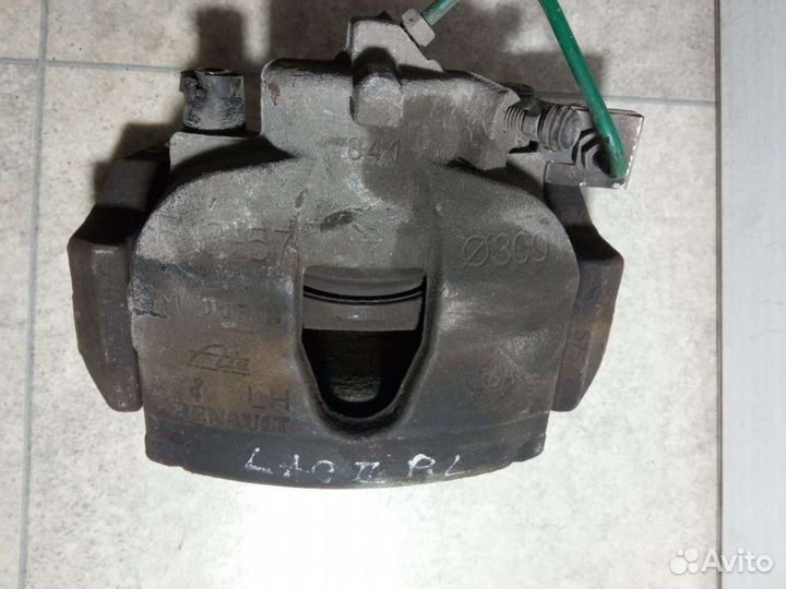 Суппорт тормозной передний левый Renault Laguna 2