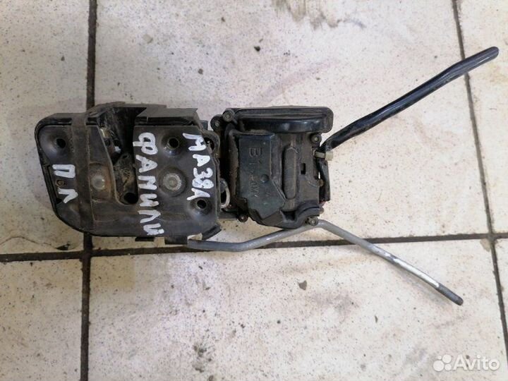 Замок дверной передний левый Mazda Familia