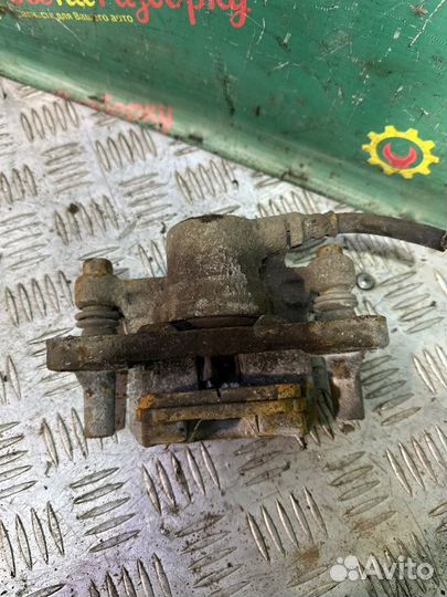 Суппорт задний левый Mitsubishi Lancer 9