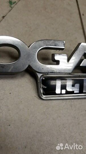 Эмблема крышки багажника Renault Logan