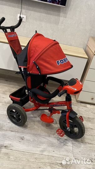 Трехколесный велосипед с ручкой