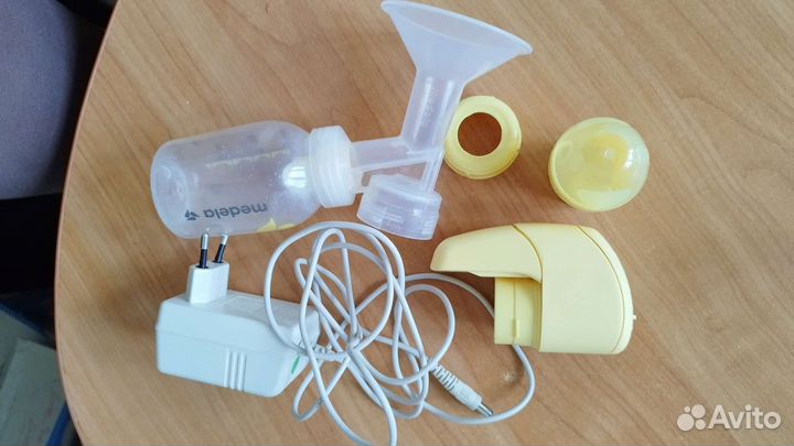 Молокоотсос medela электрический