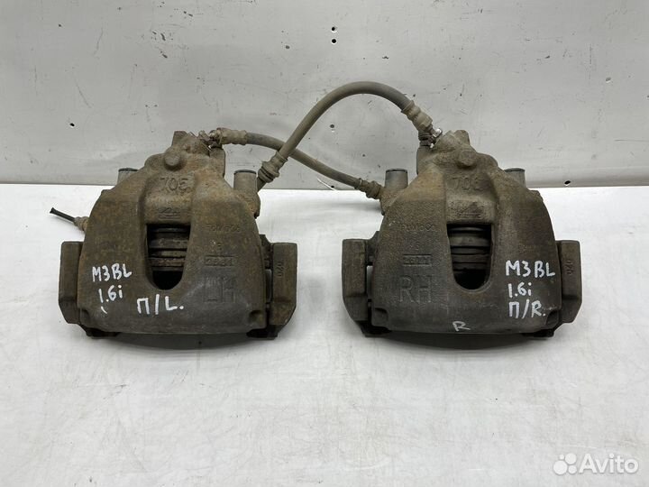 Суппорт передний левый / правый Mazda 3 BL 1.6