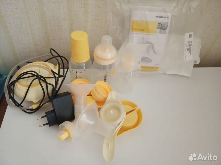 Молокоотсос Medela 2 шт (электрический + механич.)
