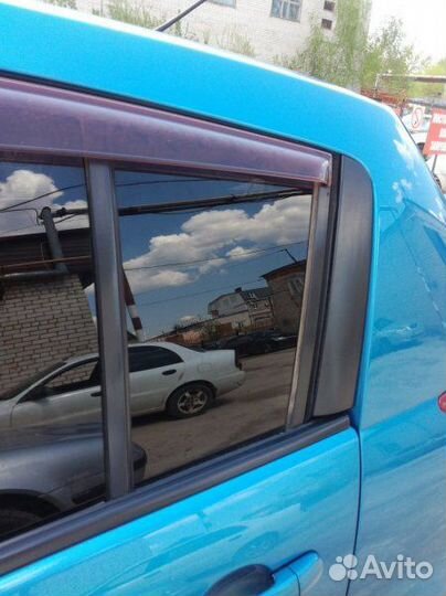 Стекло дверное заднее левое Nissan Tiida C11 1.5