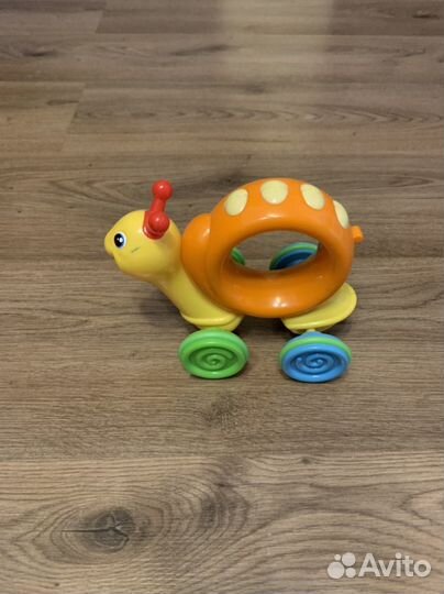 Улитка каталка игрушка механическая