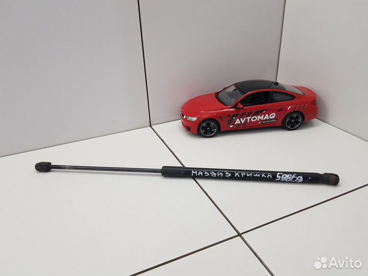 Амортизатор багажника левый (Mazda 3)