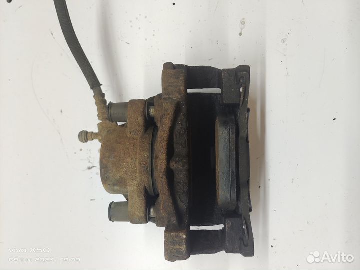 Суппорт тормозной передний левый Freelander 2