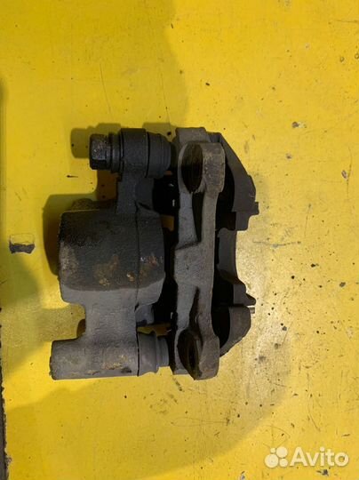 Суппорт задний левый Geely Vision