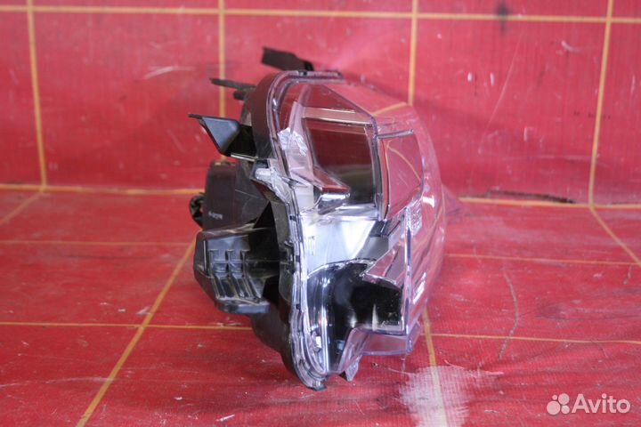 Фара левая Mitsubishi Pajero Sport