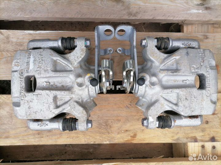 Задний тормозной суппорт мазда 3 bm