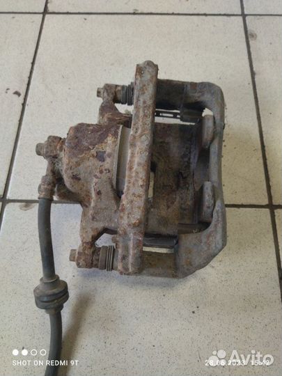 Суппорт тормозной передний левый Chevrolet Cruze