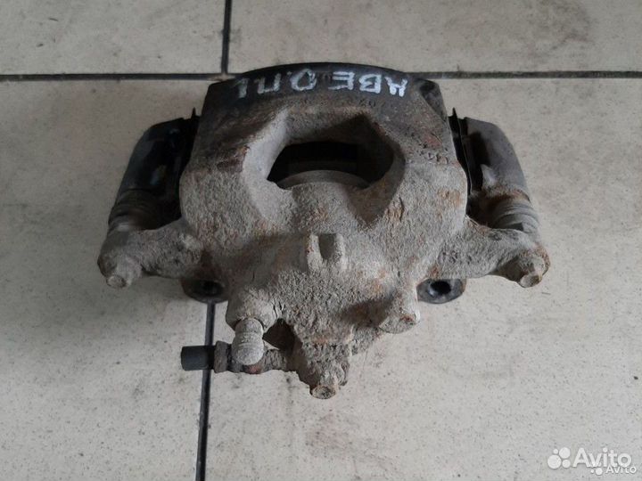 Тормозной суппорт передний левый Chevrolet Авео Т3