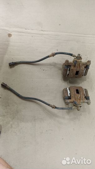 Суппорт тормозной правый левый Шевроле Лачетти