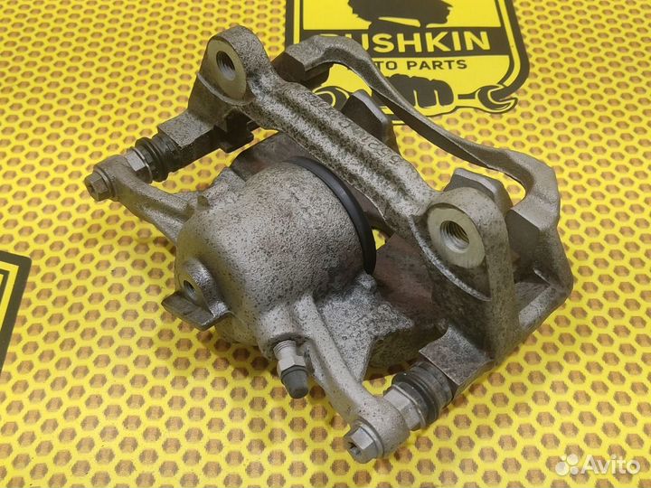 Суппорт тормозной передний левый Volkswagen Jetta