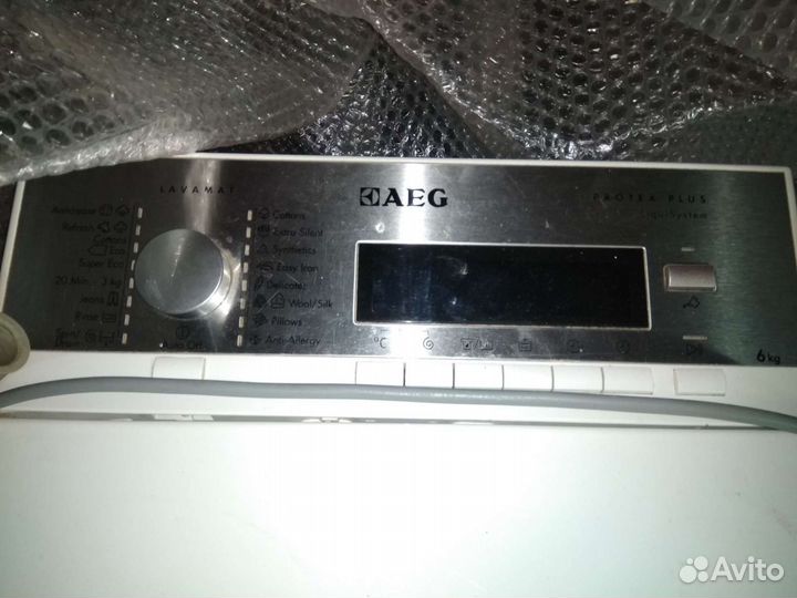 Стиральная машина AEG с вертикальной загрузкой