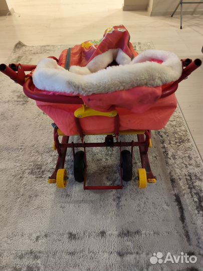 Санки на колесах с шубкой и складной ручкой