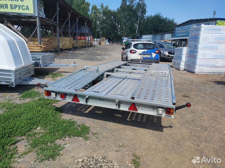 Прицеп-эвакуатор с платформой над колесами.Фаркоп