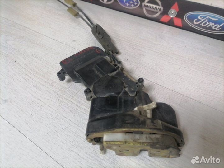 Замок двери задний левый Mazda Mazda6