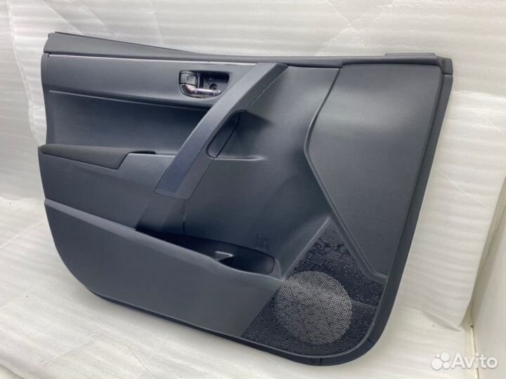 Обшивка двери передняя левая Toyota Corolla