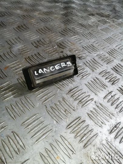 Фонарь подсветки номера задний левый Mitsubishi