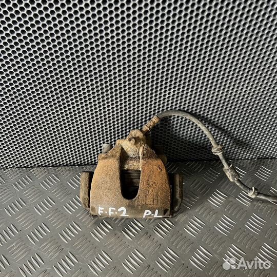 Суппорт тормозной передний левый Ford Focus