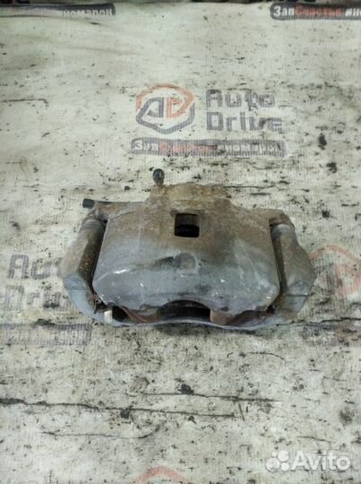 Суппорт тормозной передний левый Mitsubishi Lancer