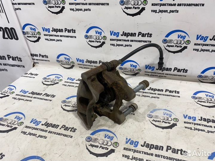 Суппорт тормозной задний левый Volkswagen Tiguan