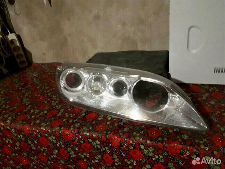Стекло на фару Mazda 6