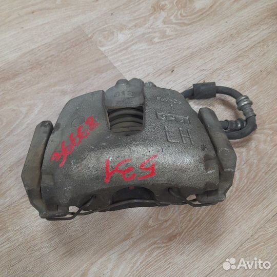 Суппорт тормозной передний левый Mazda 3 BK