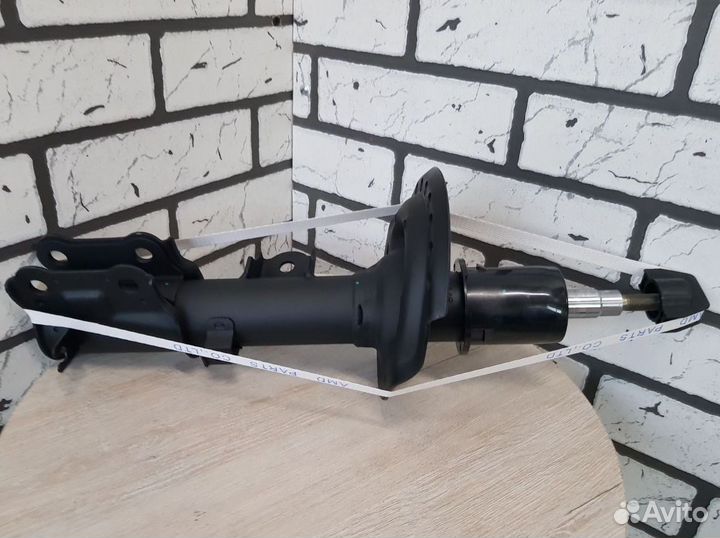 Автомобильный амортизатор киа передний лев