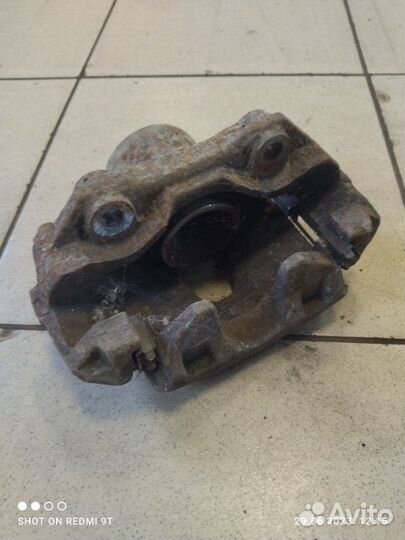 Суппорт тормозной передний левый Volkswagen Polo