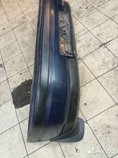 Задний бампер Mazda 323 BG слепая